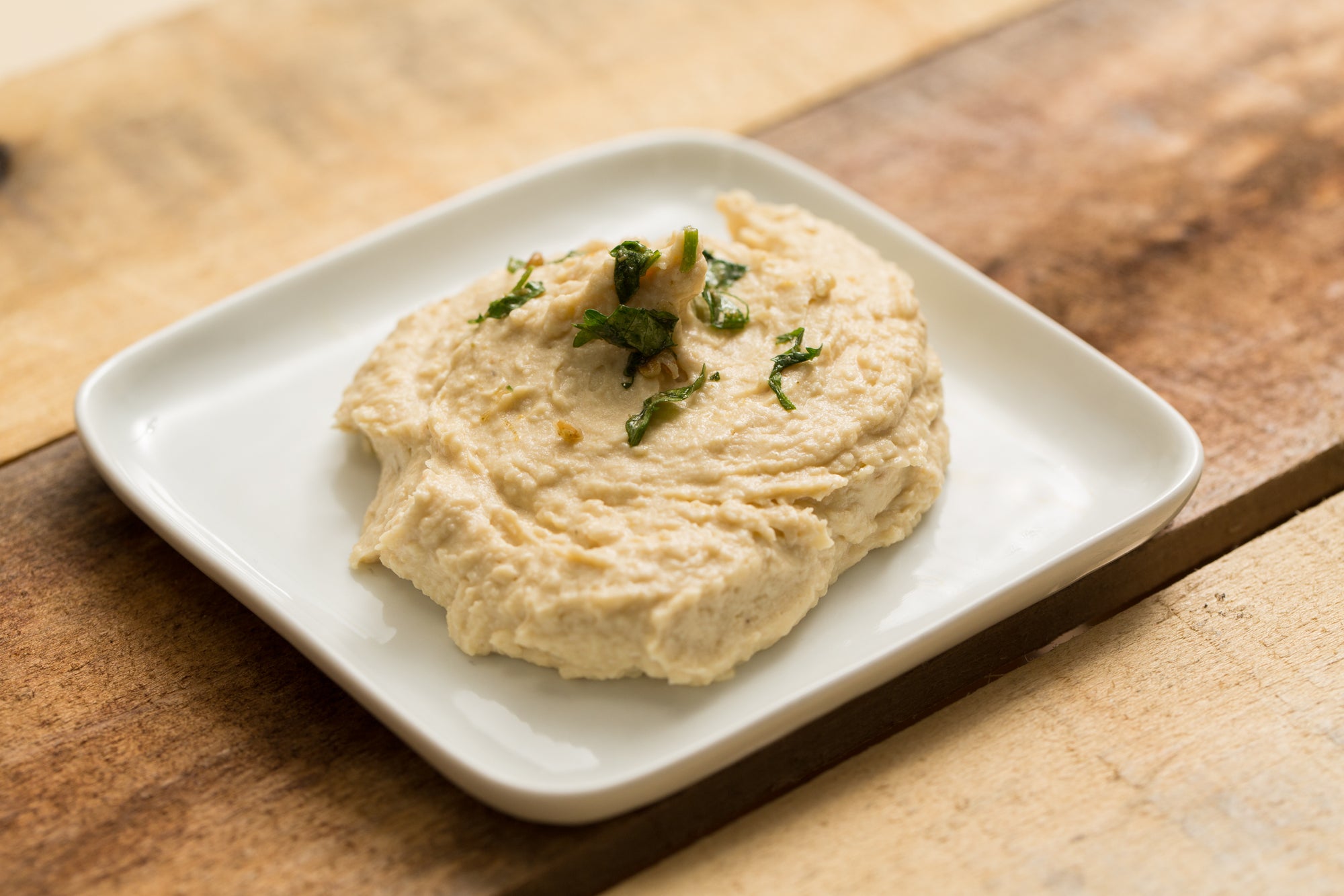 Chickpea hummus on a white plate
